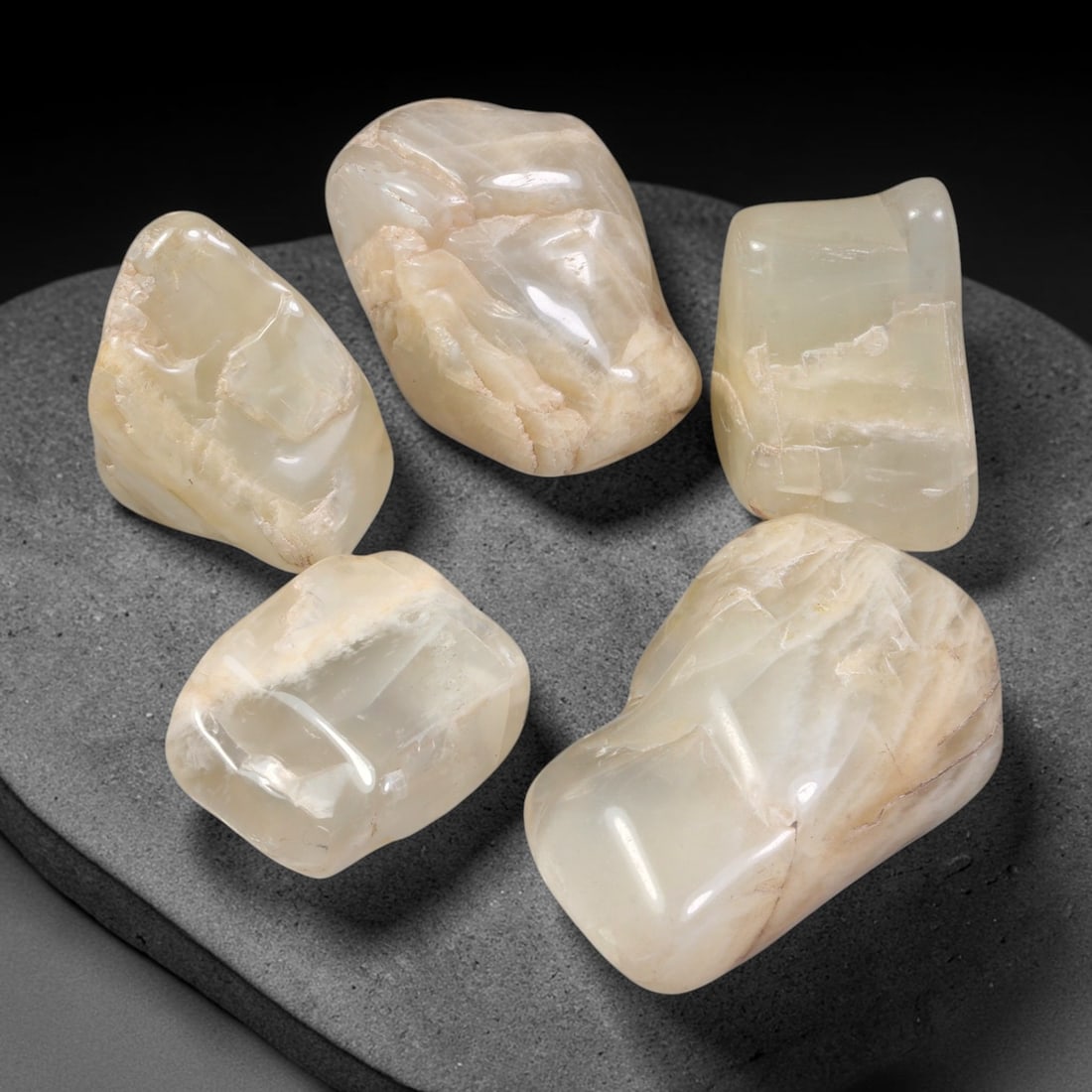 357ct Natural Ceylon Moonstone Tumbled Rough Parcel Lot, 3EW: This parcel features naturally tumbled Ceylon moonstone rough displaying soft creamy pale-hued translucent bodies with natural internal fractures and textural layering. Smooth water-worn surfaces show