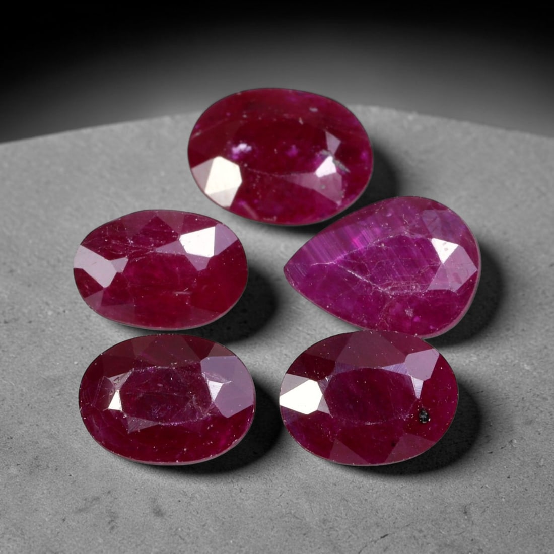 5.71ct Natural Tanzanian Longido Ruby Loose Gemstone Parcel Lot, 22EV: This fine parcel of Longido rubies features deep rich crimson-red colour across uniform oval faceted cuts. Natural internal textures lend authentic character to each stone, while well-formed facets ca