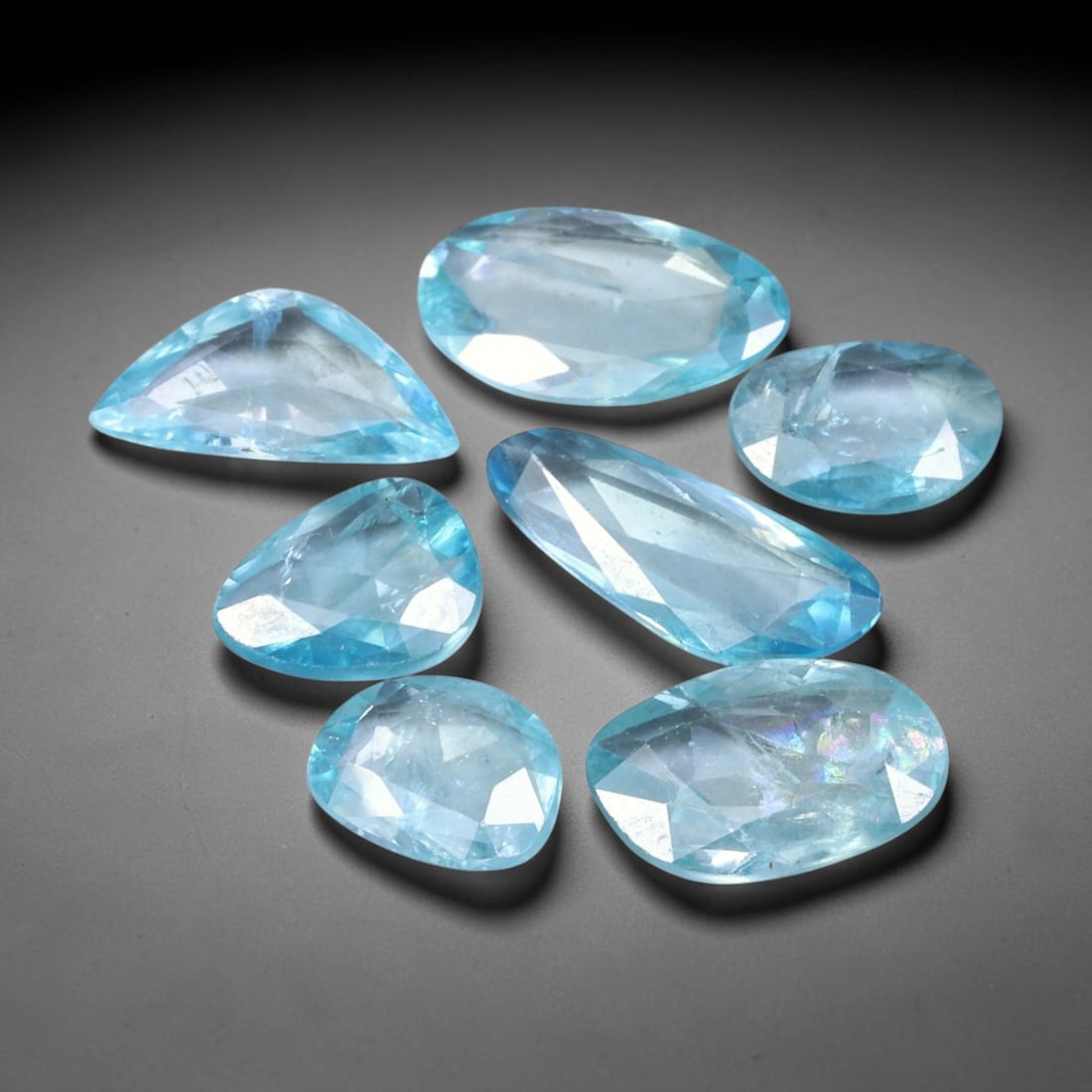 11.57ct Natural Cambodian Rose Cut Blue Zircon Loose Gemstone Parcel Lot, 17EV: This attractive parcel of rose-cut blue zircon features cool aquatic blue tones paired with flat-backed rose cut faceting, creating soft diffused sparkle and dreamy translucent visual effect. Varied f