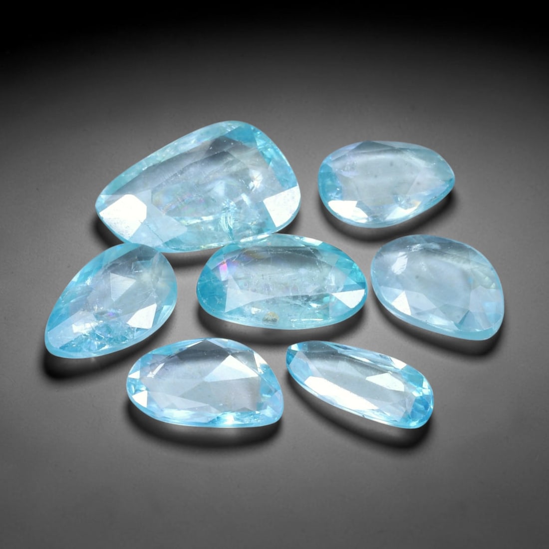 13.57ct Natural Cambodian Rose Cut Blue Zircon Loose Gemstone Parcel Lot, 19EV: This attractive parcel of rose-cut blue zircon features cool aquatic blue tones paired with flat-backed rose cut faceting, creating soft diffused sparkle and dreamy translucent visual effect. Varied f