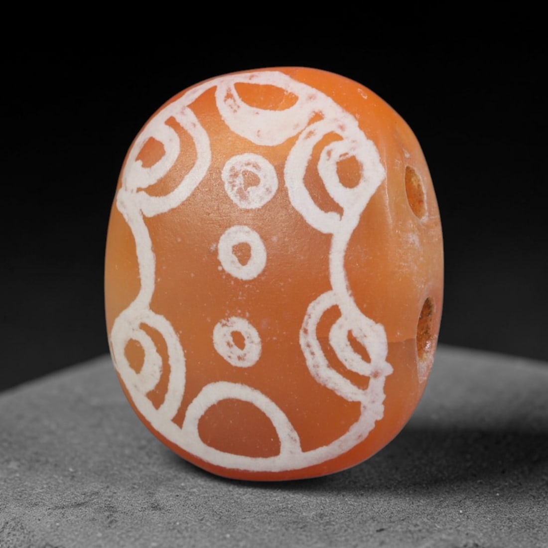 Antique Sino-Himalayan Region Etched Carnelian Bead, 15EH: Antique etched carnelian bead originating from the Sino-Himalayan region. Exhibits characteristic surface patina and traditional etched white decoration. Dimensions: 15x12mm, fully pierced for suspens