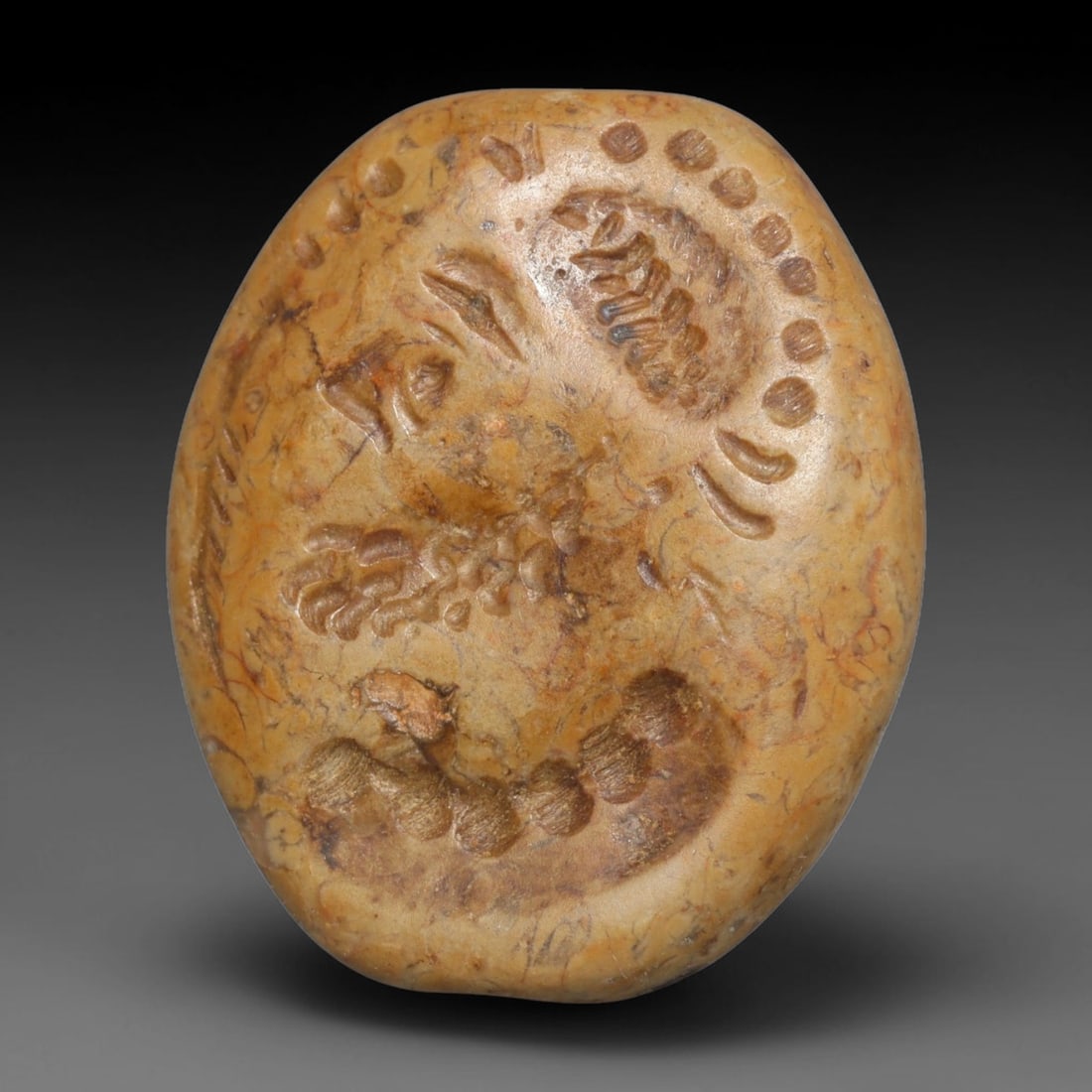 Ancient Sasanian Persian Intaglio Bead (224-651 CE), 94EC: This antique intaglio bead originates from the Sasanian Persian Empire, renowned for carved stone beads crafted as wearable protective talismans and personal identity markers throughout late antiquity