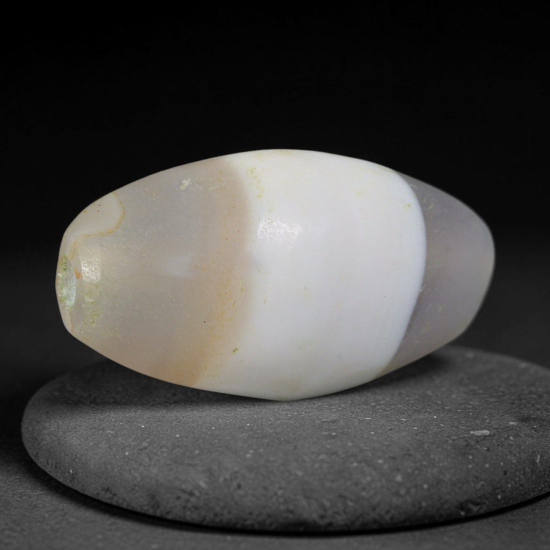 Ancient Mauryan Empire Wide White Single Band Pale Grey Agate Barrel Bead (322-185 BCE), 5AE: This striking single-band agate barrel bead originates from India's Mauryan Empire, one of South Asia's earliest unified great civilizations with sophisticated agate carving traditions producing sacre