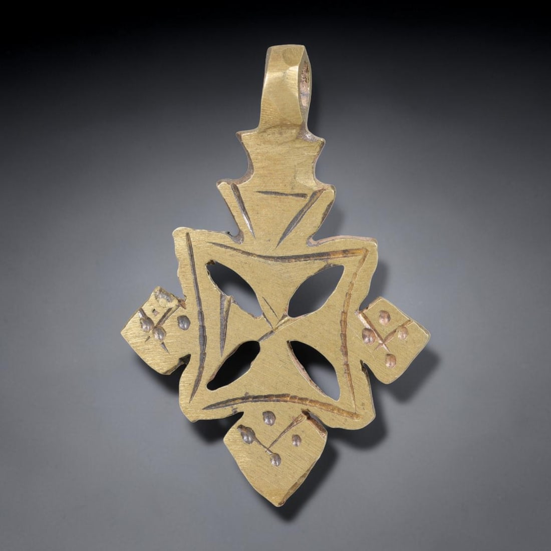 Vintage Ethiopian Copper Alloy Cross Pendant, 20EJ: Crafted from copper alloy, this traditional Ethiopian cross pendant features integrated suspension loop for wear. Shows authentic surface patina consistent with vintage origin. Dimensions: 4.5x3cm. So