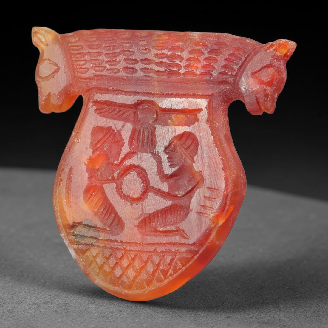 Vintage Natural Carnelian Agate Revival Indo-Persian Glyptic Figural Talisman Amulet Plaque, 28FK: This vintage talisman pendant plaque is skillfully carved from natural banded carnelian agate, crafted in a style referencing ancient Indo-Persian glyptic art traditions. The face bears detailed relie