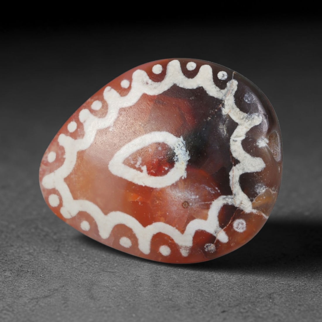 Antique Sino-Himalayan Region Etched Carnelian Bead, 97EG: Antique etched carnelian bead originating from the Sino-Himalayan region. Exhibits characteristic surface patina and traditional etched white decoration. Dimensions: 19x16mm, fully pierced for suspens