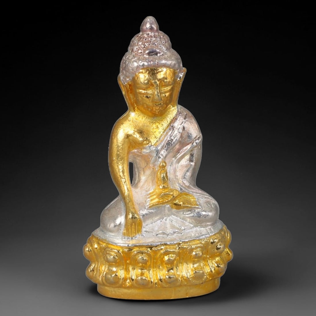 Thai Dual-Tone Metal Mini Sacred Statuette Amulet, 99FP: Small cast metal sacred figurine with intricate sculpted detailing throughout the body, cranial adornment and layered pedestal base. Varied metallic finishes are applied to distinct sections of the st