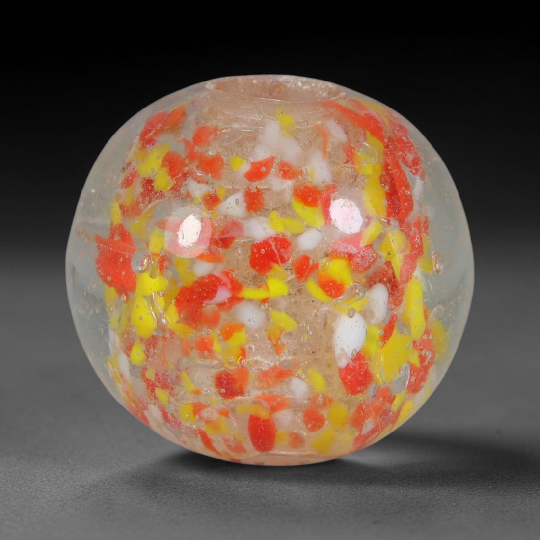 Vintage Confetti Speckled Blown Glass Bead - Handmade Spherical Ornament, 29AE: This rounded spherical bead is hand-blown from clear translucent glass embedded with scattered fragmented confetti inclusions of bright red, lemon yellow and opaque white glass flecks suspended throug