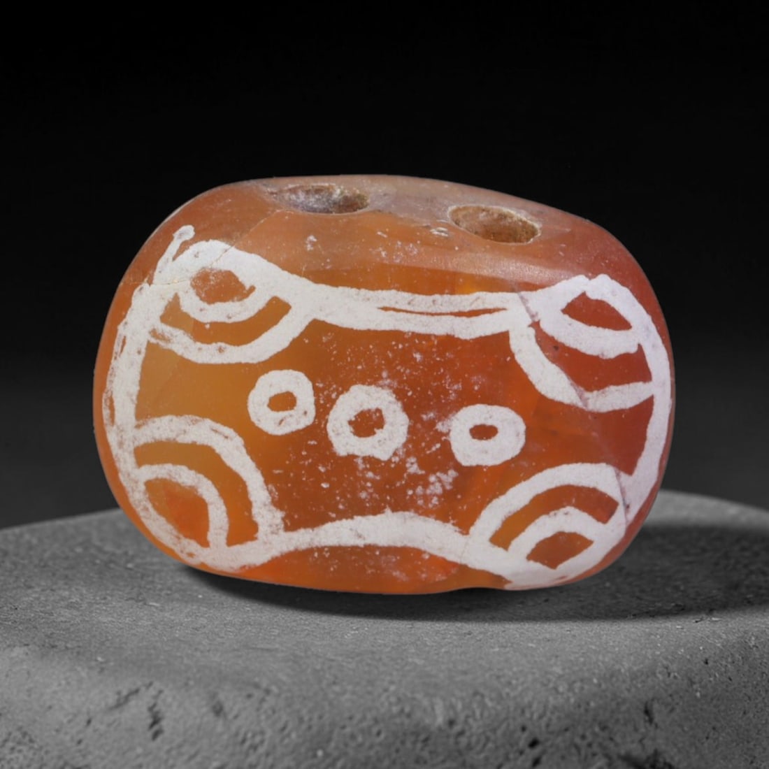 Antique Sino-Himalayan Region Etched Carnelian Bead, 86EG: Antique etched carnelian bead originating from the Sino-Himalayan region. Exhibits characteristic surface patina and traditional etched white decoration. Dimensions: 16x11mm, fully pierced for suspens
