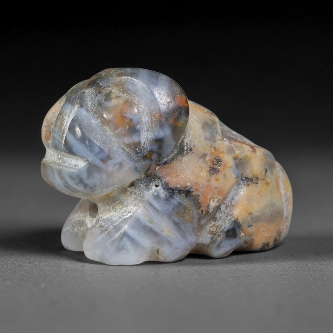 Ancient Sasanian Persian Agate Feline Amulet Bead (224-651 CE), 18EC: This antique recumbent feline amulet bead carved from natural agate originates from the Sasanian Persian Empire, where zoomorphic talismans embodied guardianship and protective power for personal ador