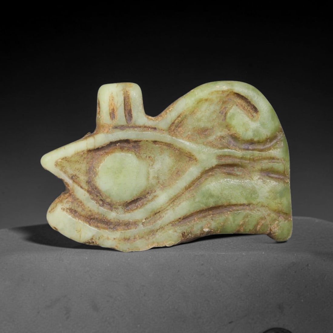 Ancient Predynastic & Pharaonic Egyptian Civilization Stone Wedjat Eye Amulet (4000 BCE-30 CE), 12EF: This ancient stone Wedjat Eye amulet originates from Predynastic & Pharaonic Egyptian Civilization, an iconic protective talisman embodying healing, divine protection and spiritual wholeness in ancien