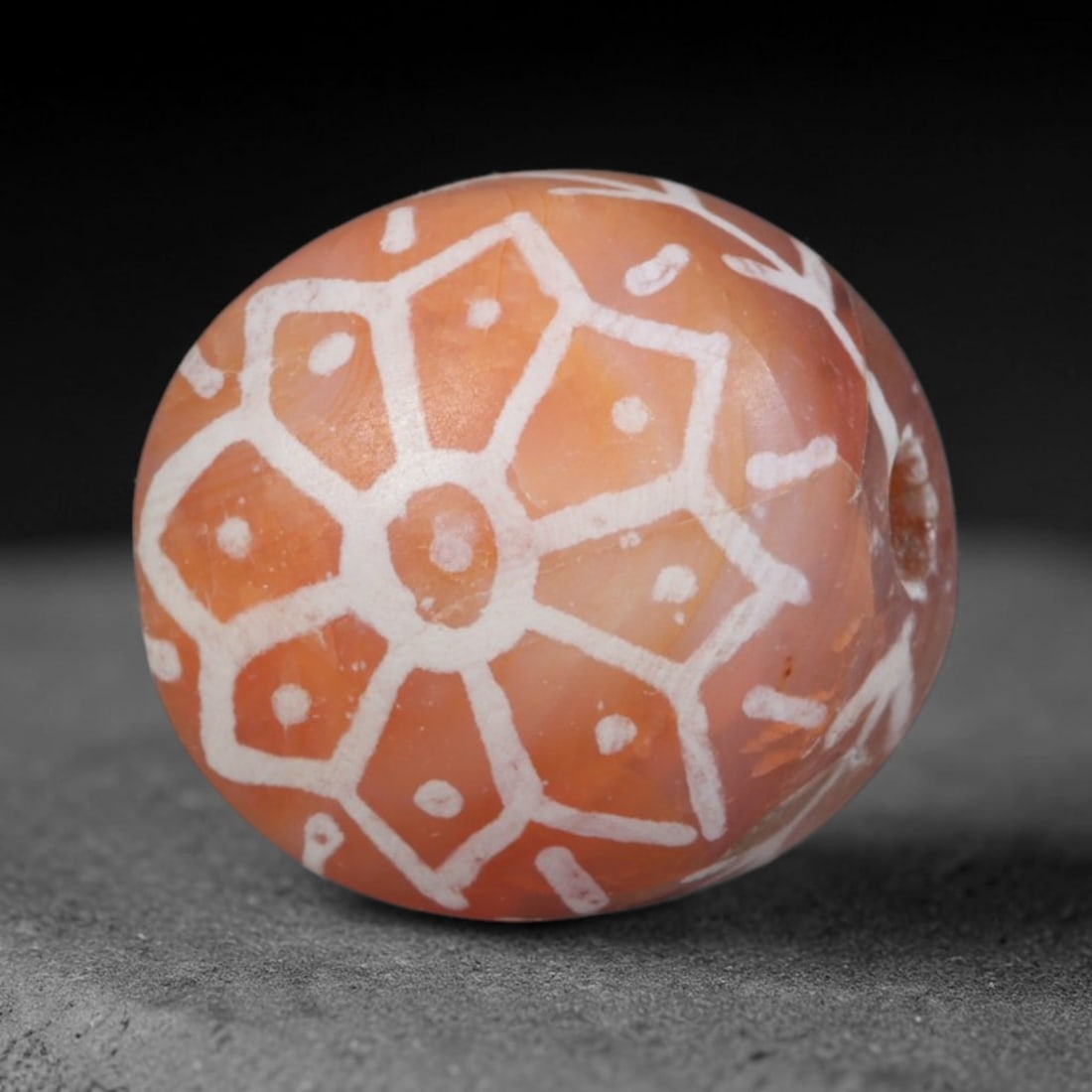 Antique Sino-Himalayan Region Etched Carnelian Bead, 13EH: Antique etched carnelian bead originating from the Sino-Himalayan region. Exhibits characteristic surface patina and traditional etched white decoration. Dimensions: 13x12mm, fully pierced for suspens
