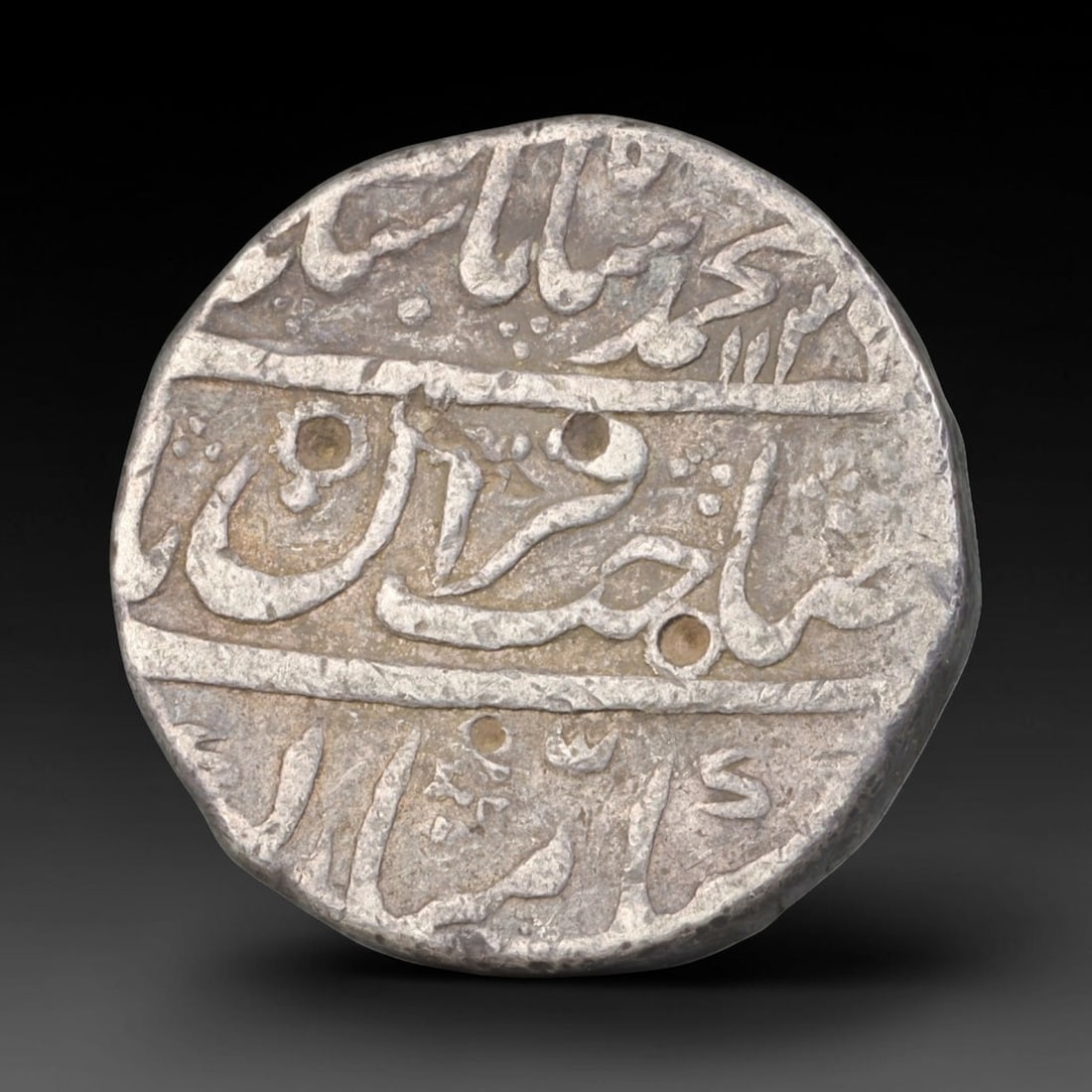 Antique Mughal Islamic Calligraphic Silver Coin (1526-1857 CE), 48EQ: This authentic silver coin originates from the Mughal Empire, struck with elegant flowing Islamic calligraphic script arranged across both obverse and reverse faces, characteristic of Mughal numismati