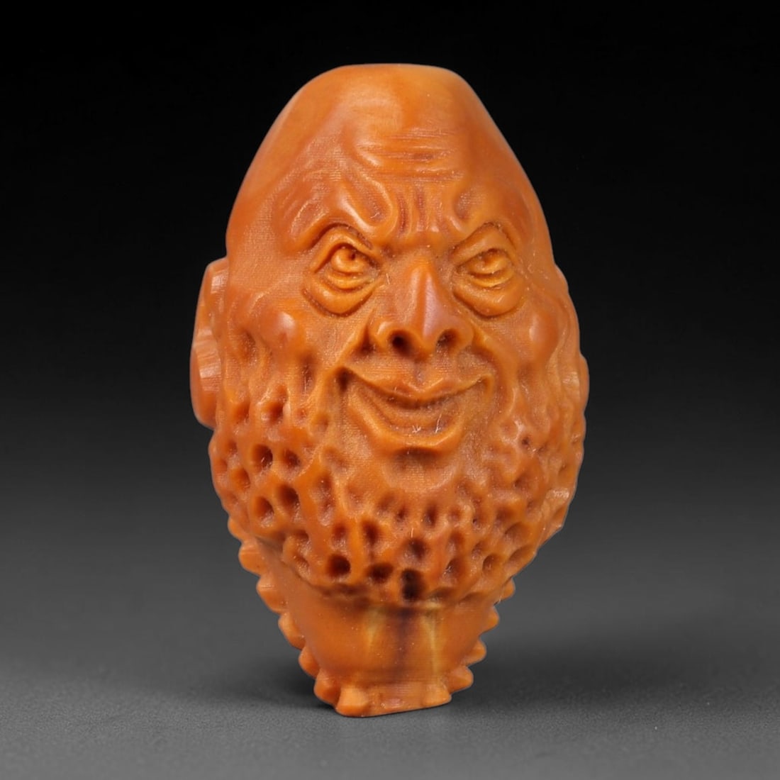A Chinese Carved Natural Olive Nut Drilled Art Bead, 21BZ: Traditional craft bead carved from solid natural olive nut core, representing a classic miniature Chinese micro-carving folk art piece with a pre-drilled suspension bore integrated for easy threading 