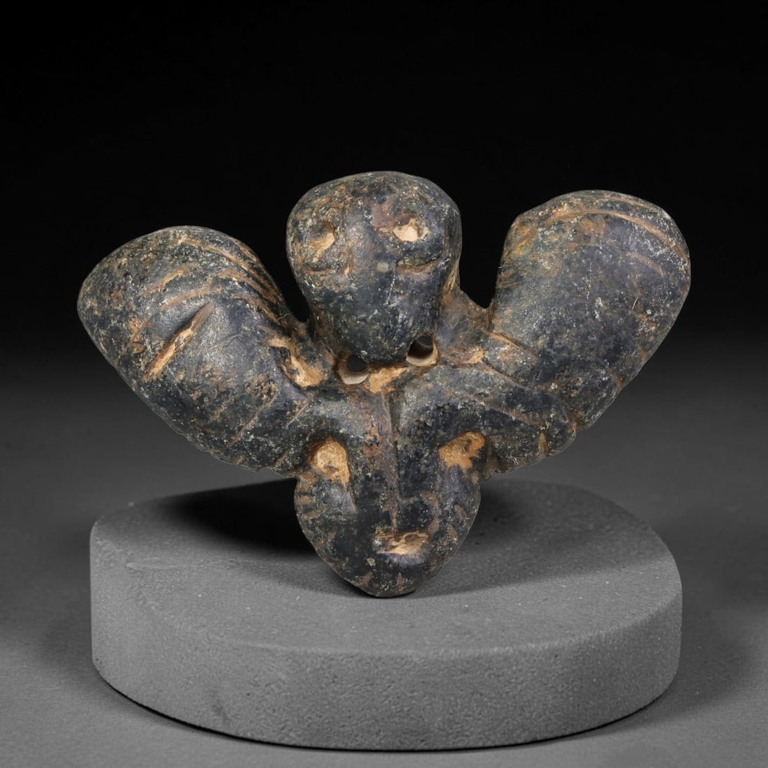 Ancient Neo-Hittite Dark Stone Vulture Amulet (1200-800 BCE), 31EF: This stylized avian amulet is carved from dark weathered stone, originating from Iron Age Neo-Hittite cultures of Northern Syria and Eastern Anatolia, modelled as a vulture with fully outstretched win