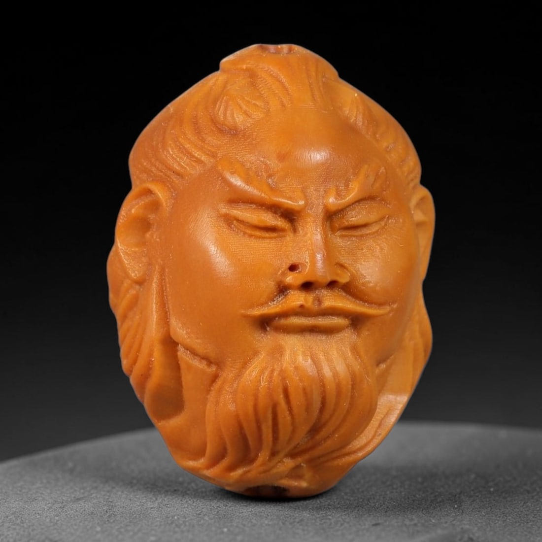 A Chinese Carved Natural Olive Nut Drilled Art Bead, 36BZ: Traditional craft bead carved from solid natural olive nut core, representing a classic miniature Chinese micro-carving folk art piece with a pre-drilled suspension bore integrated for easy threading 