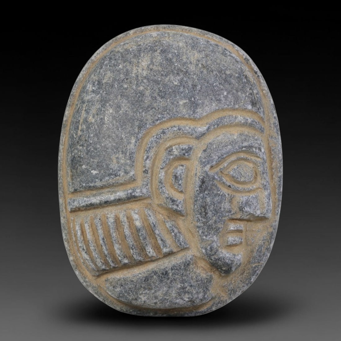 Antique Egyptian Schist Intaglio with Profile Head Carving, 32AA: Hand-carved antique Egyptian amulet tablet crafted from dark grey schist stone, measuring 4.5cm x 3.5cm. The front face features a finely detailed profile human head with incised stylized hair rendere