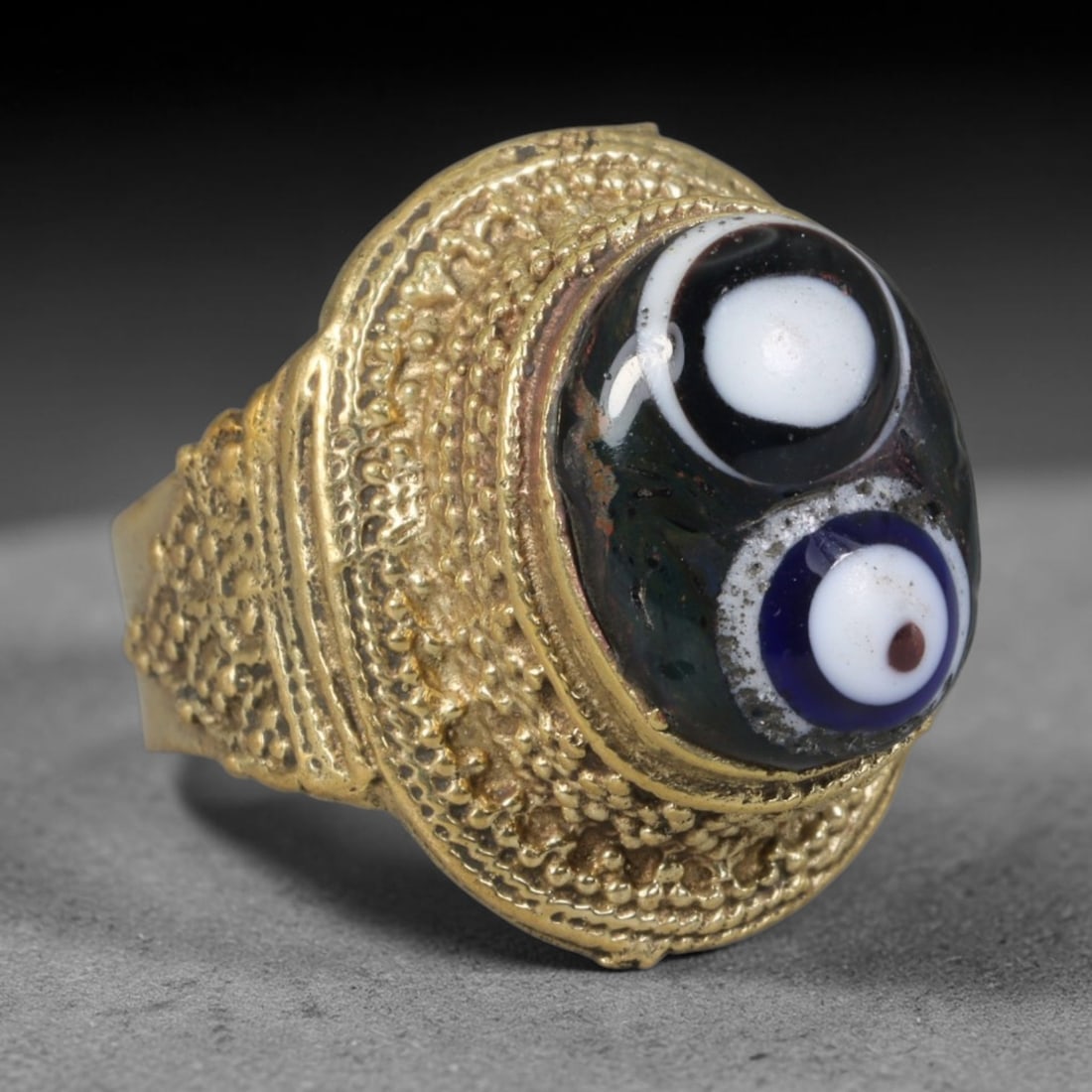 Antique Islamic Millefiori Evil Eye Glass Cabochon Set Vintage Signet Ring (1700-1900 CE), 25AM: The primary collectible value resides within the inset antique millefiori evil-eye glass cabochon, authentic genuine antique glass (distinguished from earlier ancient glass and modern vintage glass) c