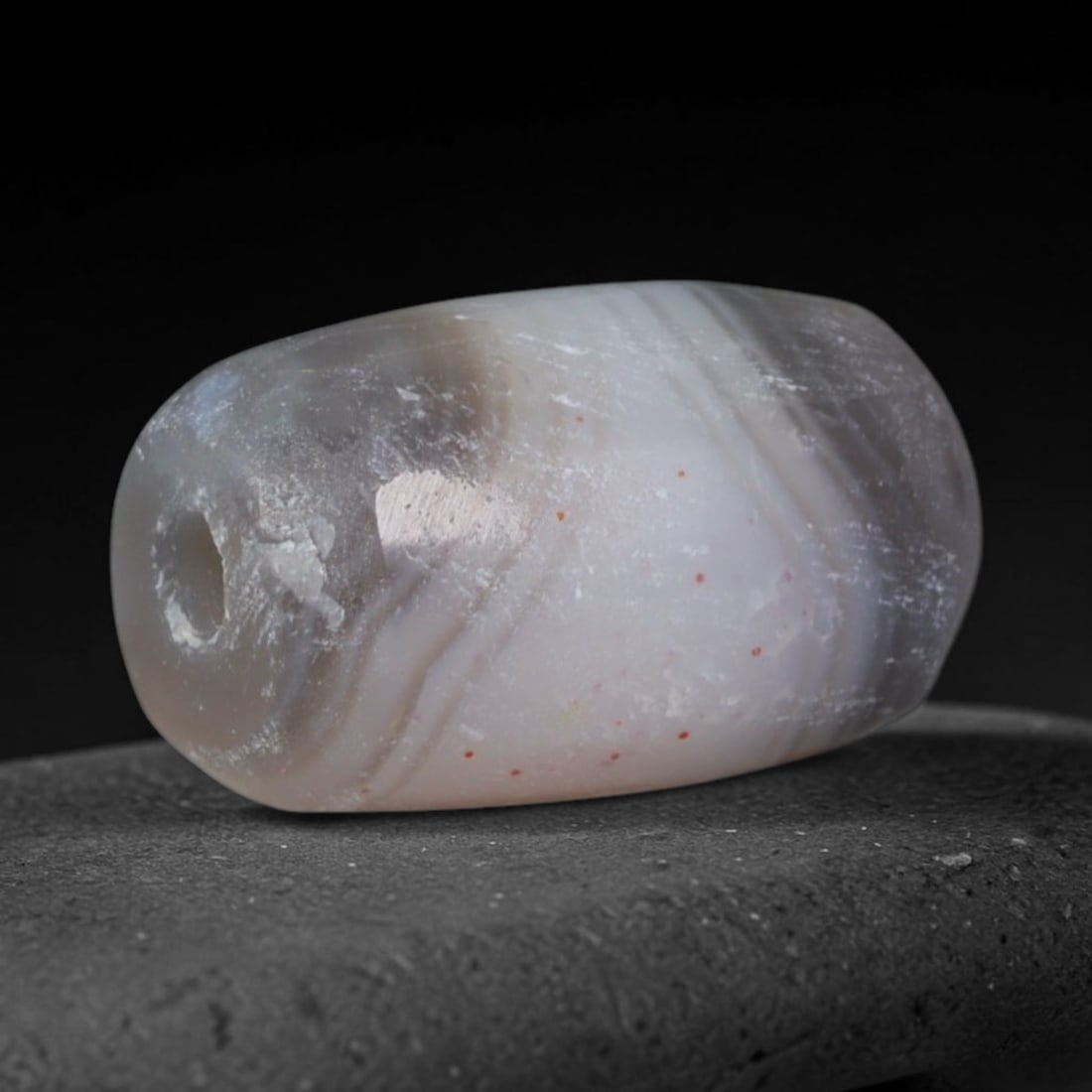 Ancient Babylonian & Kassite Cultures Banded Agate Barrel Bead (1900-600 BCE), 21AD: This antique banded agate barrel bead originates from the Babylonian & Kassite Cultures, prominent Mesopotamian societies that utilized banded agate beads for temple offerings and elite royal funerary