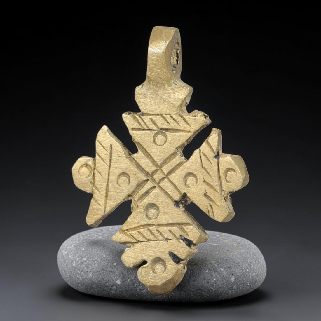 Vintage Ethiopian Copper Alloy Cross Pendant, 14EJ: Crafted from copper alloy, this traditional Ethiopian cross pendant features integrated suspension loop for wear. Shows authentic surface patina consistent with vintage origin. Dimensions: 3.7x2.5cm. 