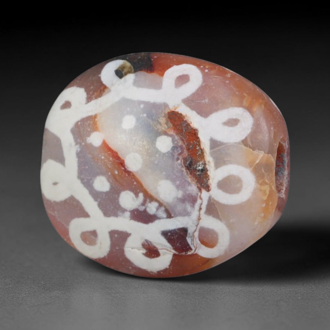 Antique Sino-Himalayan Region Etched Carnelian Bead, 90EG: Antique etched carnelian bead originating from the Sino-Himalayan region. Exhibits characteristic surface patina and traditional etched white decoration. Dimensions: 12x10mm, fully pierced for suspens