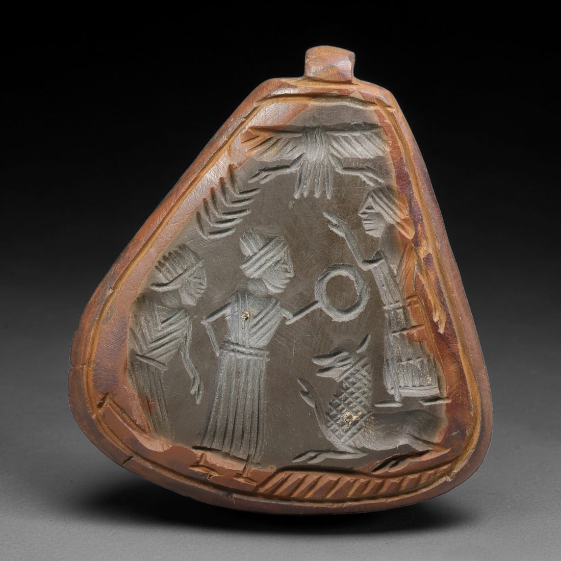 Vintage Natural Carnelian Agate Revival Indo-Persian Glyptic Figural Talisman Amulet Plaque, 32FK: This vintage talisman pendant plaque is skillfully carved from natural banded carnelian agate, crafted in a style referencing ancient Indo-Persian glyptic art traditions. The face bears detailed relie