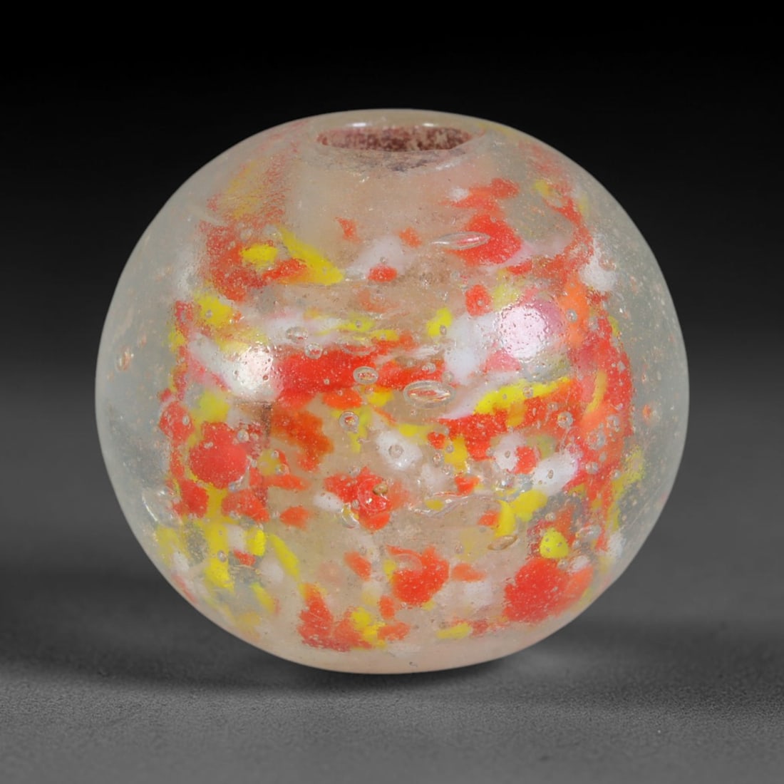 Confetti Speckled Blown Glass Bead - Handmade Vintage Spherical Ornament, 34AE: This rounded spherical bead is hand-blown from clear translucent glass embedded with scattered fragmented confetti inclusions of bright red, lemon yellow and opaque white glass flecks suspended throug