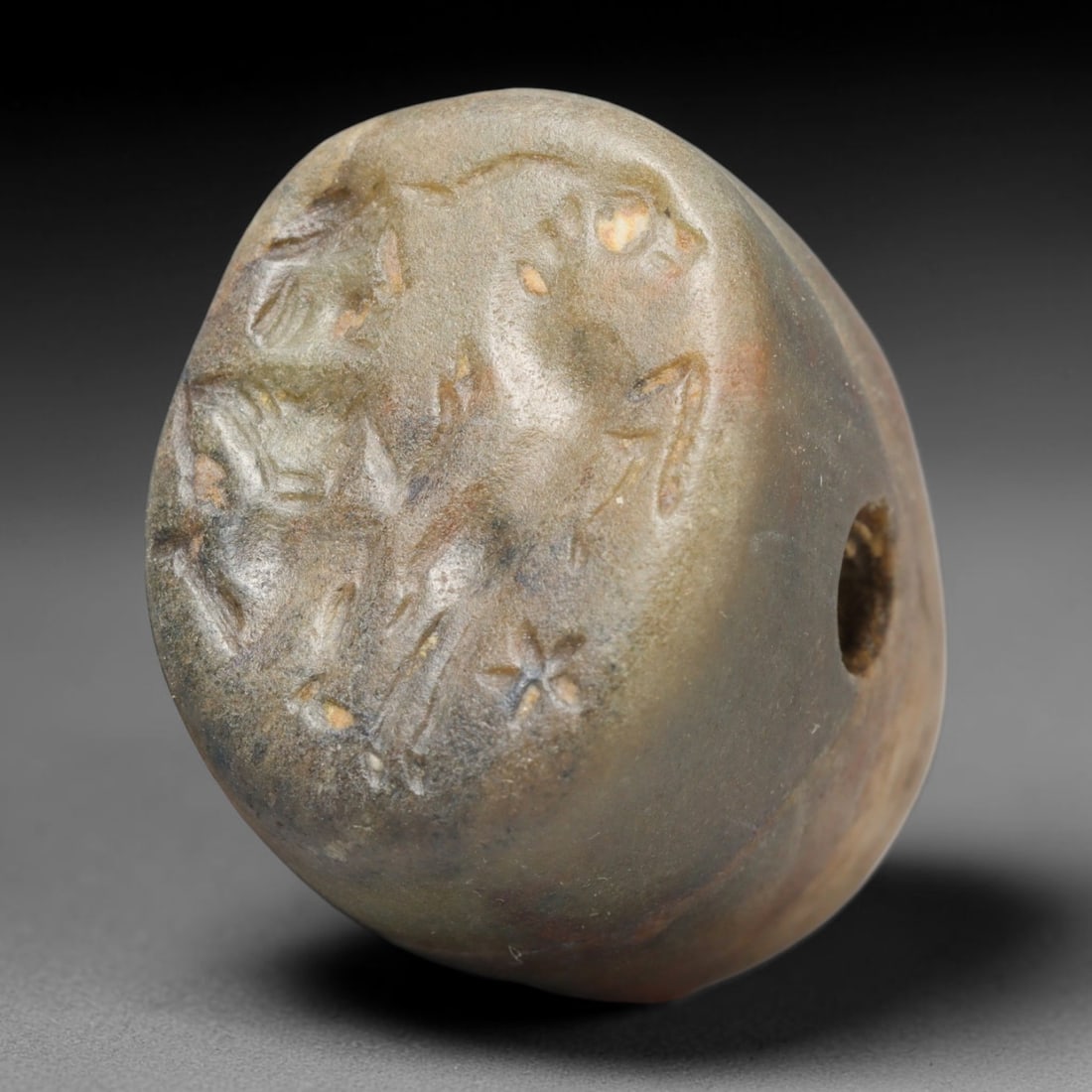 Ancient Sasanian Persian Conoid Stamp Seal (224-651 CE), 82EC: This antique muted greenish stone conoid stamp seal originates from the Sasanian Persian Empire, crafted as a wearable pierced talisman for personal sealing and spiritual protection along Silk Road ne