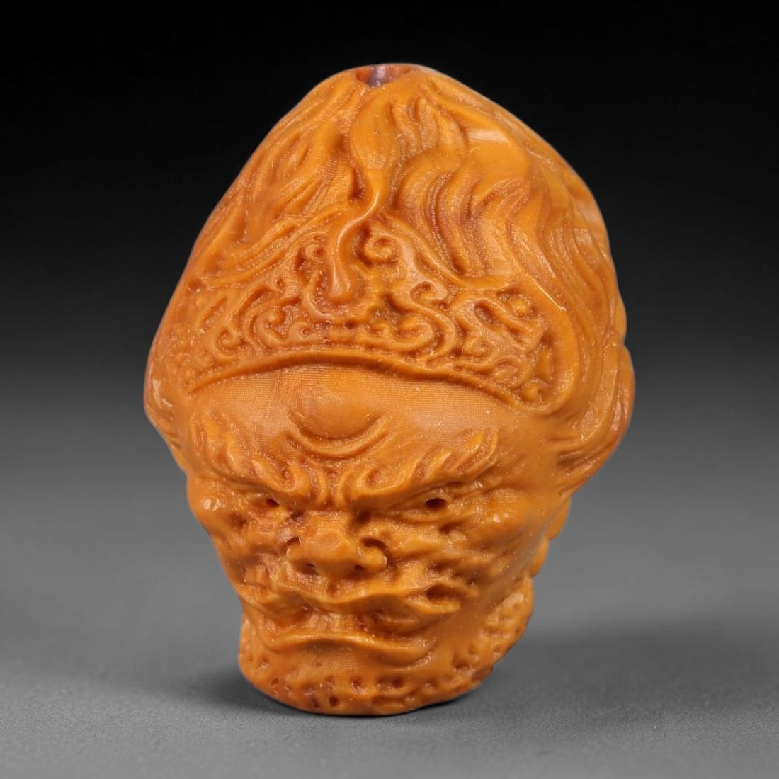 A Chinese Carved Natural Olive Nut Drilled Art Bead, 33BZ: Traditional craft bead carved from solid natural olive nut core, representing a classic miniature Chinese micro-carving folk art piece with a pre-drilled suspension bore integrated for easy threading 