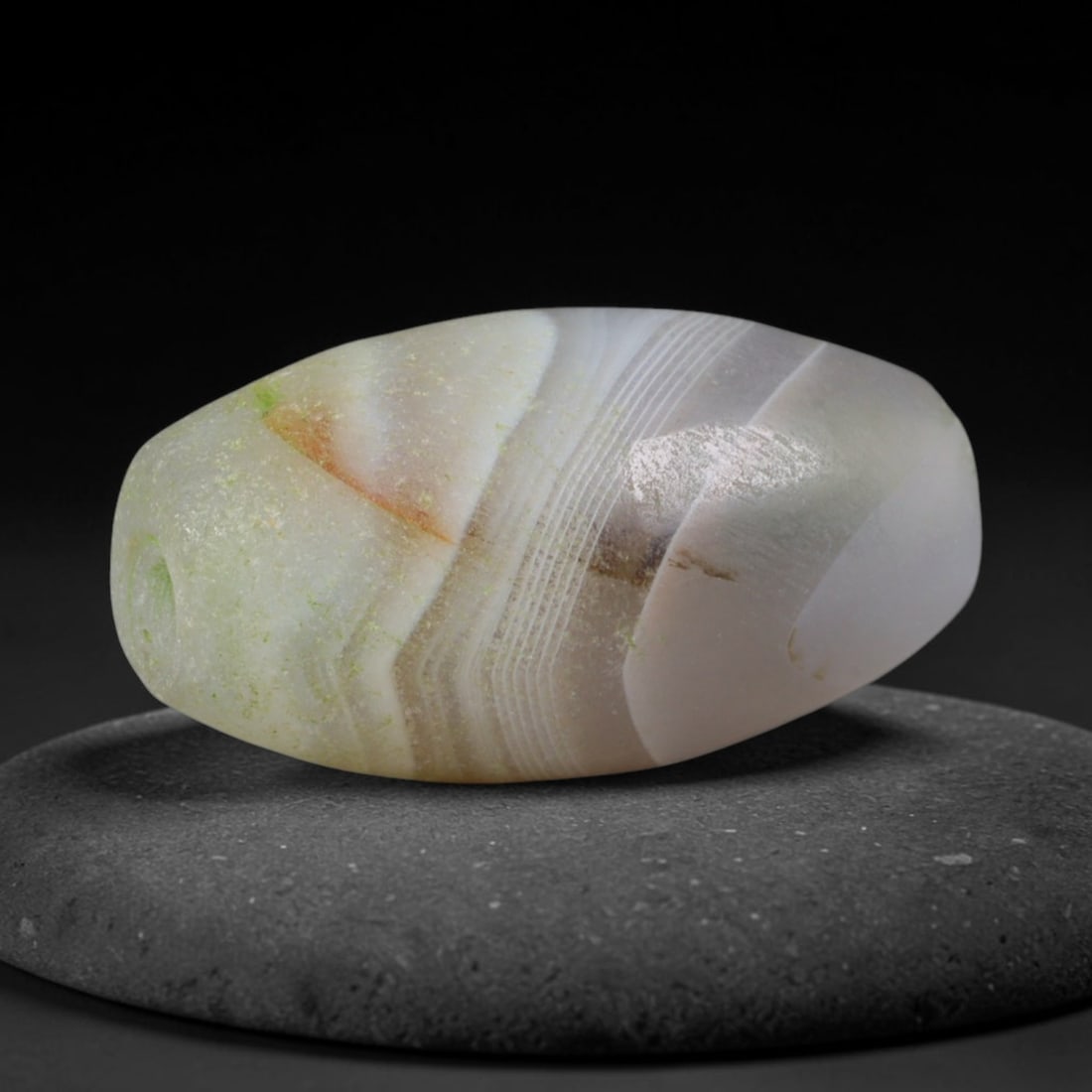 Ancient Old Babylonian Civilization Banded Agate Barrel Bead (1894-1595 BCE), 26AD: This antique banded agate barrel bead originates from the Old Babylonian Civilization, a foundational Mesopotamian culture with well-documented agate bead workshops producing ritual jewelry and burial