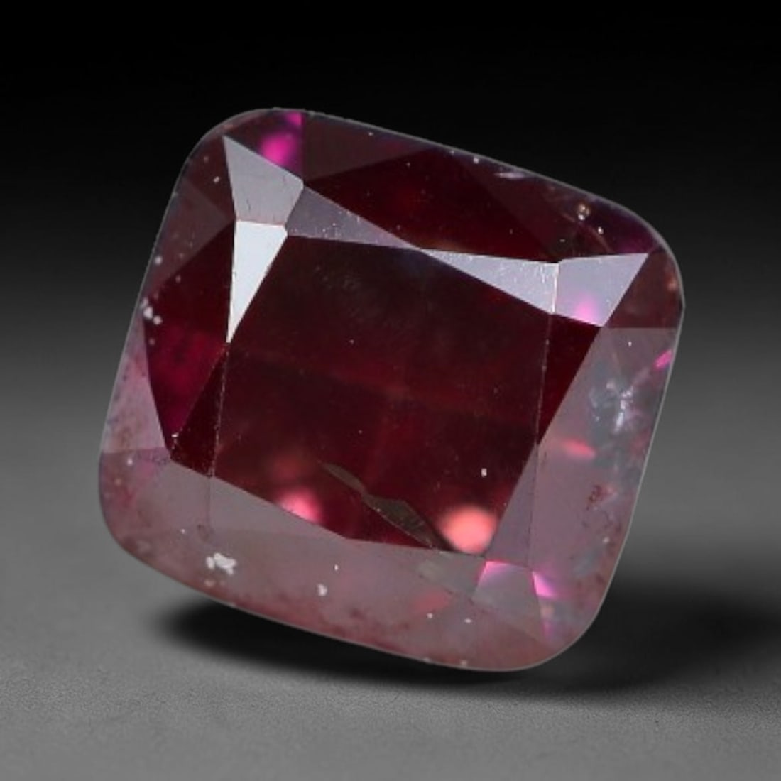 0.27ct Natural Fancy Pinkish Purple Diamond Loose Gemstone, 28BG: This polished natural diamond displays rich pinkish-purple body saturation, with subtle fine microscopic mineral specks distributed within its crystal interior, measured at calibrated dimensions of 3m