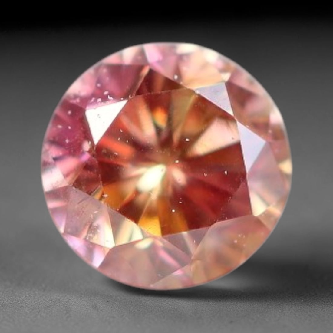 0.09ct Natural Fancy Pinkish Purple Diamond Loose Gemstone, 99BE: This polished natural diamond displays rich pinkish-purple body saturation, with subtle fine microscopic mineral specks distributed within its crystal interior, measured at calibrated dimensions of 2.