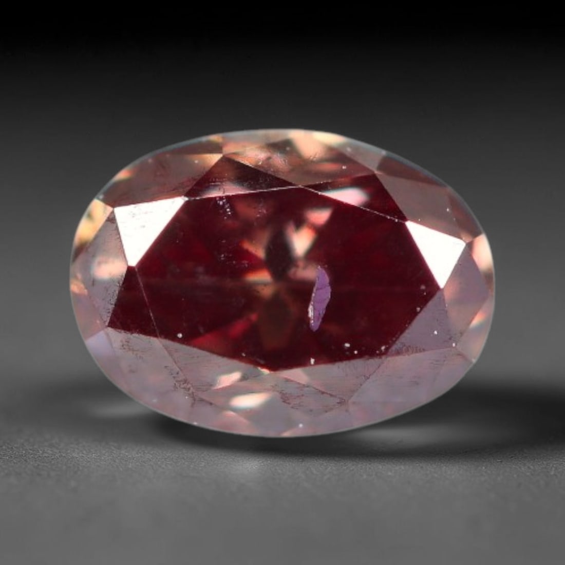 0.22ct Natural Fancy Pinkish Purple Diamond Loose Gemstone, 15BH: This polished natural diamond displays rich pinkish-purple body saturation, with subtle fine microscopic mineral specks distributed within its crystal interior, measured at calibrated dimensions of 4.