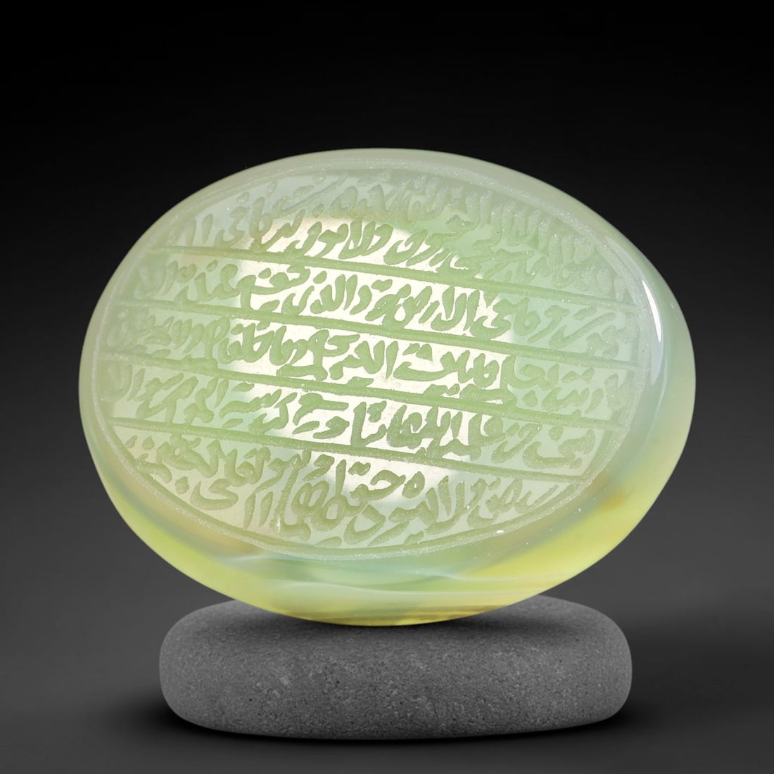 Ancient Medieval Mughal Islamic Carnelian Agate Calligraphic Script Talisman 1526-1857 CE, 47ES: Polished rich-toned carnelian agate cabochon, finely engraved with divided panels of Islamic calligraphic intaglio inscriptions. Deep crisp engraving features segmenting incised lines organizing the s