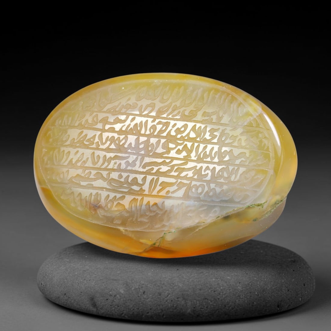 Ancient Medieval Mughal Islamic Carnelian Agate Calligraphic Script Talisman 1526-1857 CE, 30ES: Polished rich-toned carnelian agate cabochon, finely engraved with divided panels of Islamic calligraphic intaglio inscriptions. Deep crisp engraving features segmenting incised lines organizing the s