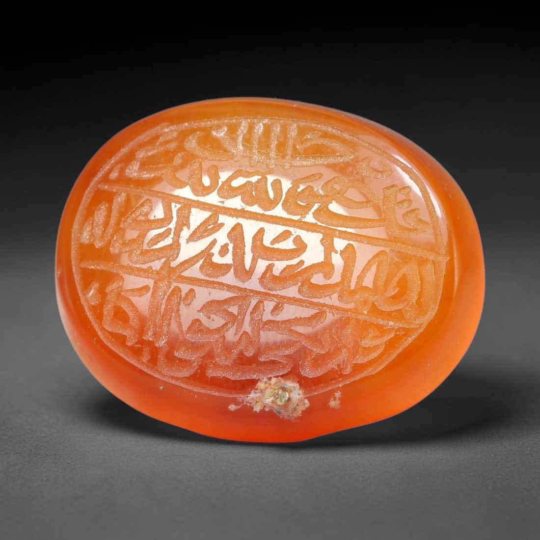 Ancient Medieval Mughal Islamic Carnelian Agate Calligraphic Script Talisman 1526-1857 CE, 92ES: Polished rich-toned carnelian agate cabochon, finely engraved with divided panels of Islamic calligraphic intaglio inscriptions. Deep crisp engraving features segmenting incised lines organizing the s
