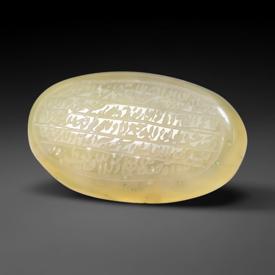 Ancient Medieval Mughal Islamic Carnelian Agate Calligraphic Script Talisman 1526-1857 CE, 30ET: Polished rich-toned carnelian agate cabochon, finely engraved with divided panels of Islamic calligraphic intaglio inscriptions. Deep crisp engraving features segmenting incised lines organizing the s