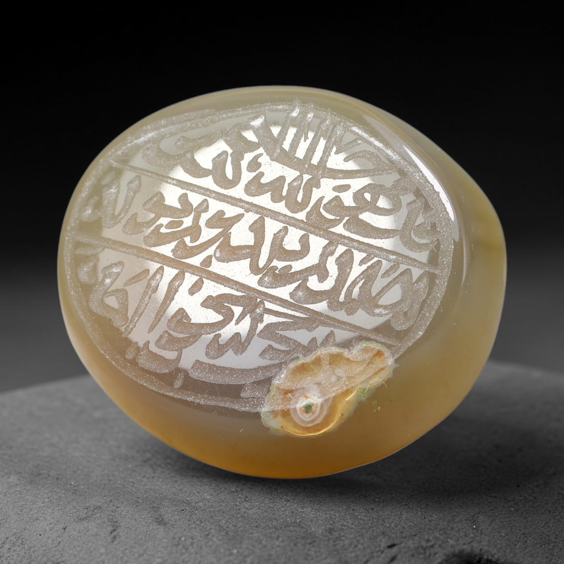 Ancient Medieval Mughal Islamic Carnelian Agate Calligraphic Script Talisman 1526-1857 CE, 22ET: Polished rich-toned carnelian agate cabochon, finely engraved with divided panels of Islamic calligraphic intaglio inscriptions. Deep crisp engraving features segmenting incised lines organizing the s