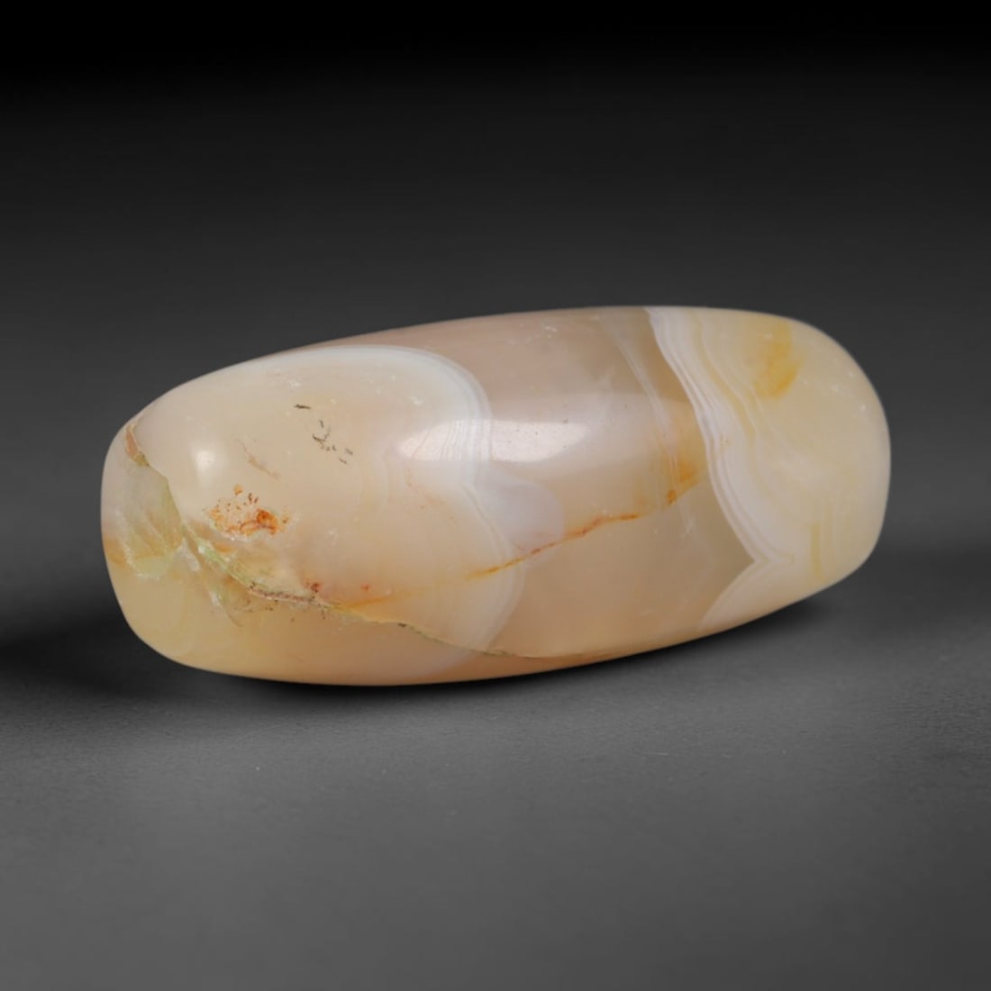 Ancient Greco-Bactrian Kingdom Banded Agate Barrel Bead (256-130 BCE), 28AD: This antique banded agate barrel bead originates from the Greco-Bactrian Kingdom, a cross-cultural Hellenistic Central Asian civilization that fused Greek and South Asian stone carving traditions to c