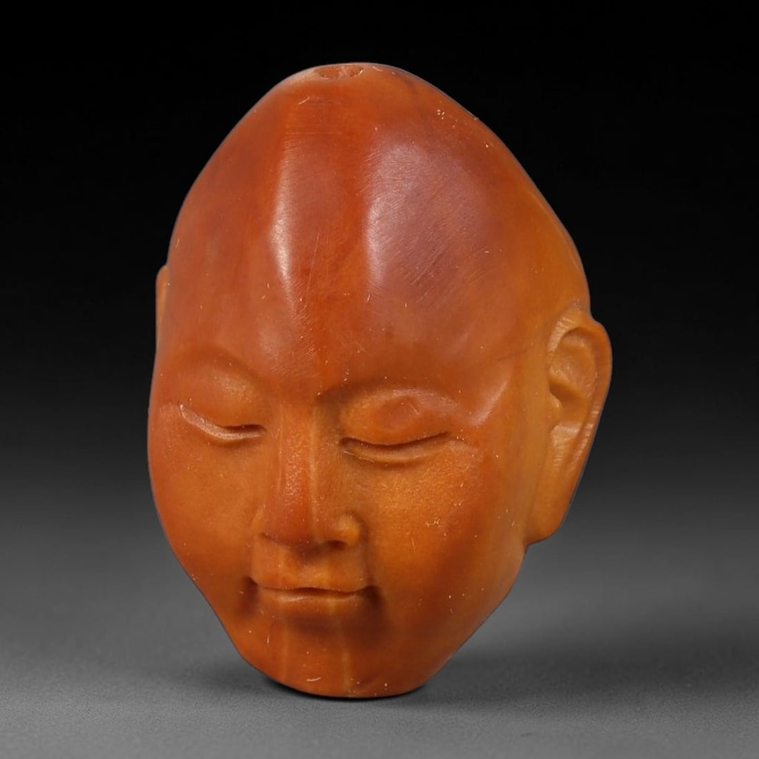 A Chinese Carved Natural Olive Nut Drilled Art Bead, 58BZ: Traditional craft bead carved from solid natural olive nut core, representing a classic miniature Chinese micro-carving folk art piece with a pre-drilled suspension bore integrated for easy threading 