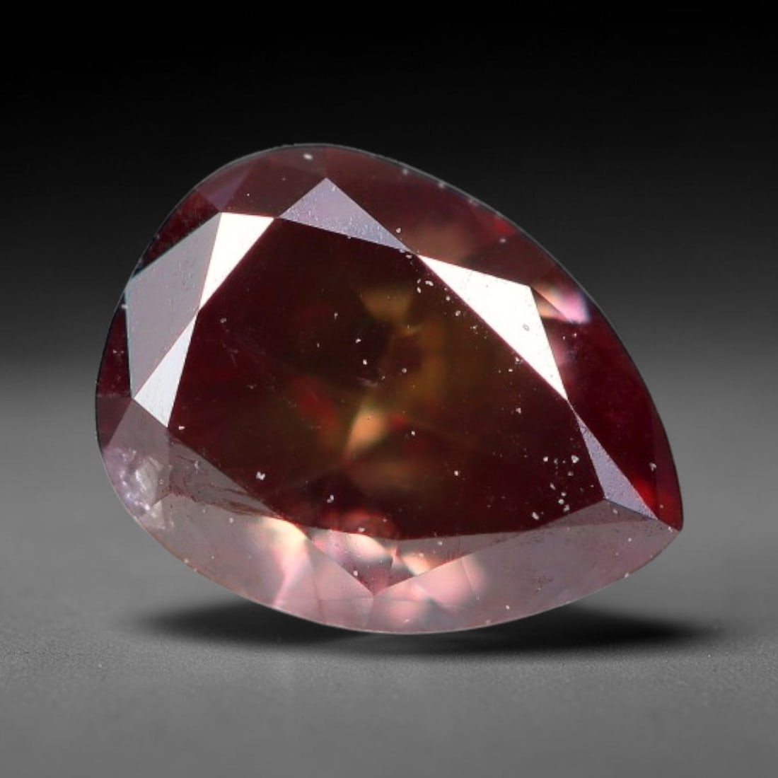 0.26ct Natural Fancy Pinkish Purple Diamond Loose Gemstone, 14BG: This polished natural diamond displays rich pinkish-purple body saturation, with subtle fine microscopic mineral specks distributed within its crystal interior, measured at calibrated dimensions of 4.