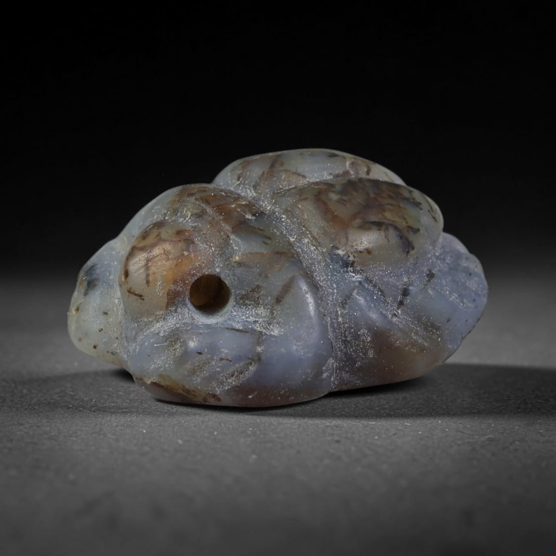 Ancient Pharaonic Egyptian Agate Scarab Amulet Bead (3100 BCE-30 CE), 13FV: This antique scarab amulet bead is carved from natural agate, originating from Pharaonic Egyptian culture. Scarabs were sacred protective talismans closely linked to rebirth and eternal life within an