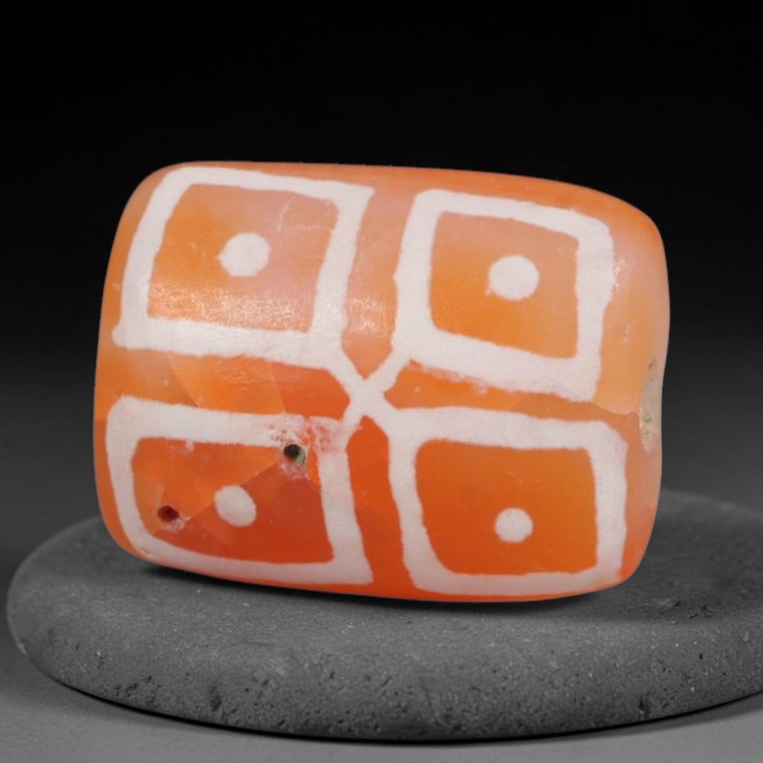Antique Sino-Himalayan Region Etched Carnelian Bead, 74EG: Antique etched carnelian bead originating from the Sino-Himalayan region. Exhibits characteristic surface patina and traditional etched white decoration. Dimensions: 12x9mm, fully pierced for suspensi