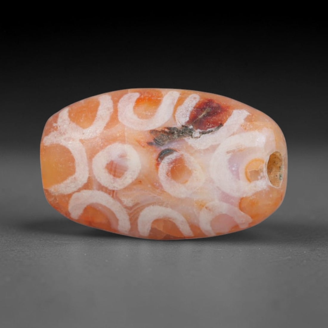 Antique Sino-Himalayan Region Etched Carnelian Bead, 75EG: Antique etched carnelian bead originating from the Sino-Himalayan region. Exhibits characteristic surface patina and traditional etched white decoration. Dimensions: 13x8mm, fully pierced for suspensi