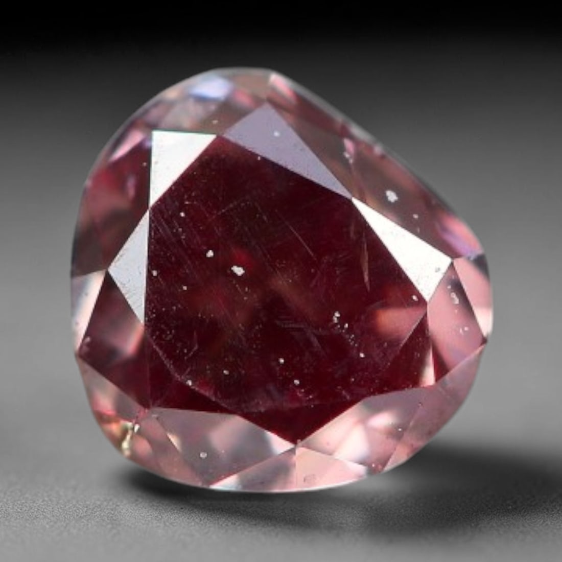 0.21ct Natural Fancy Pinkish Purple Diamond Loose Gemstone, 20BG: This polished natural diamond displays rich pinkish-purple body saturation, with subtle fine microscopic mineral specks distributed within its crystal interior, measured at calibrated dimensions of 3.