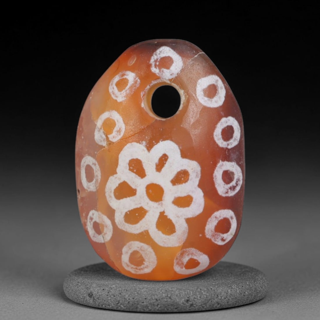Antique Sino-Himalayan Region Etched Carnelian Bead, 91EG: Antique etched carnelian bead originating from the Sino-Himalayan region. Exhibits characteristic surface patina and traditional etched white decoration. Dimensions: 15x10mm, fully pierced for suspens
