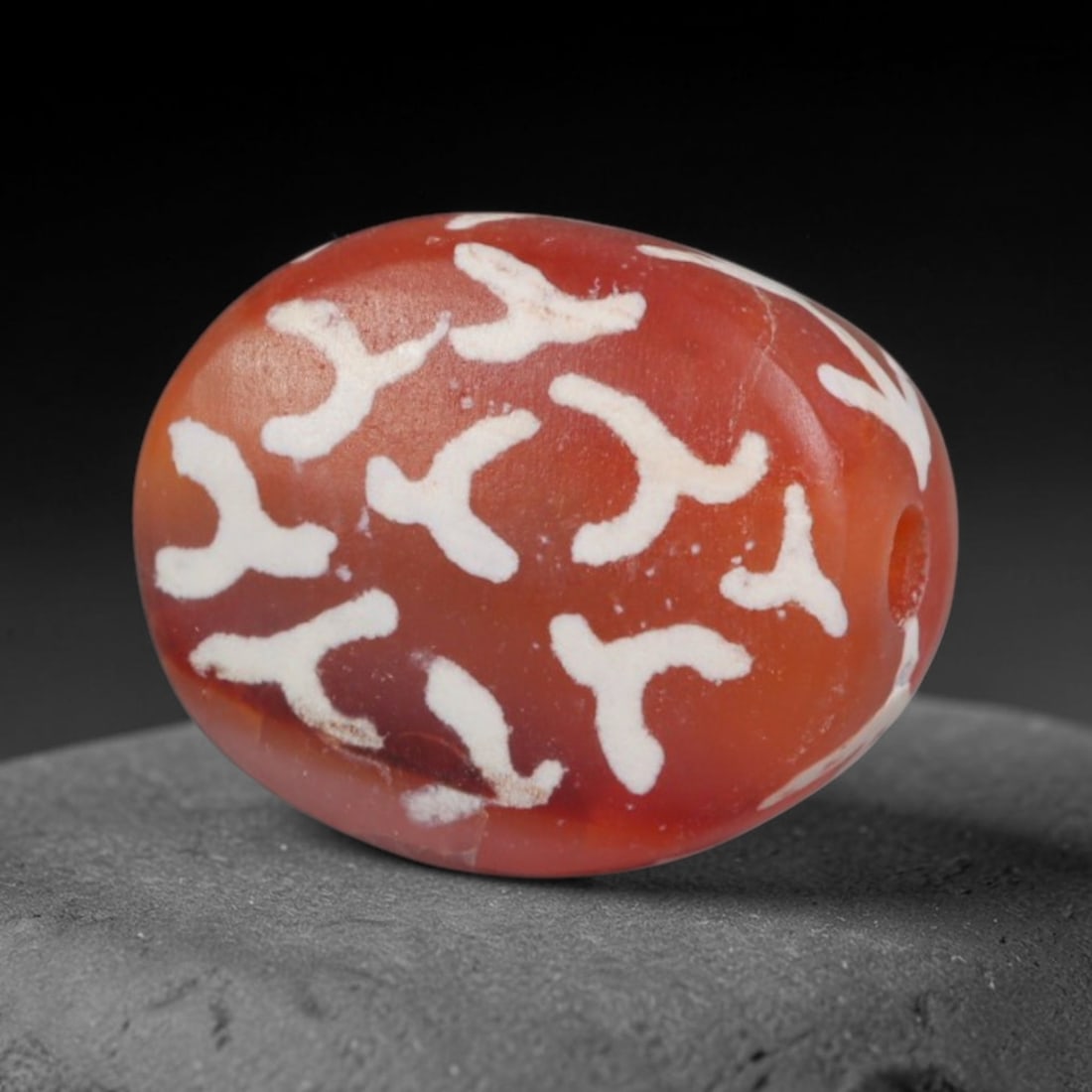 Antique Sino-Himalayan Region Etched Carnelian Bead, 14EH: Antique etched carnelian bead originating from the Sino-Himalayan region. Exhibits characteristic surface patina and traditional etched white decoration. Dimensions: 12x10mm, fully pierced for suspens