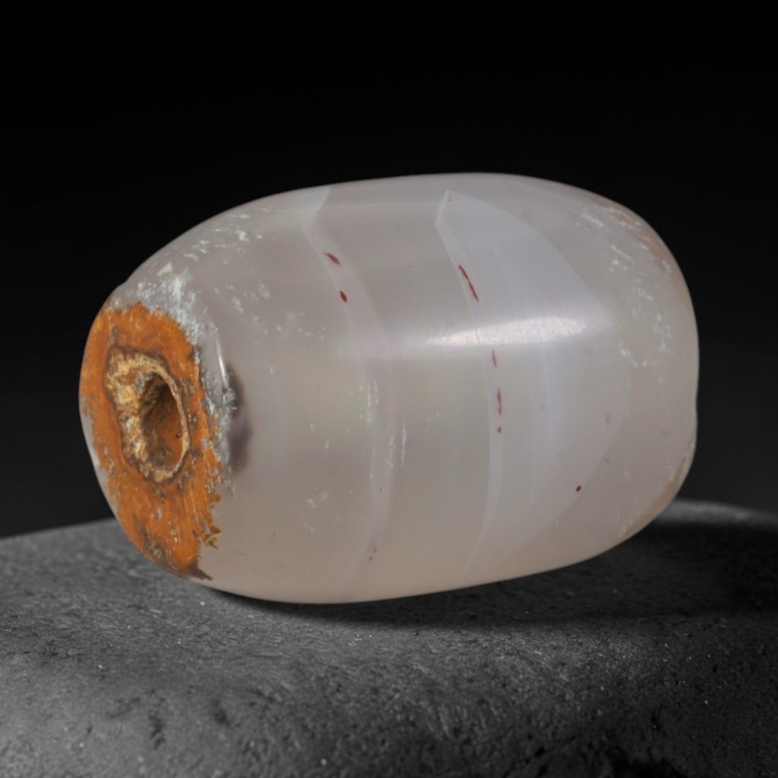 Ancient Achaemenid Persian Empire Banded Agate Barrel Bead (550-330 BCE), 45AD: This antique banded agate barrel bead originates from the Achaemenid Persian Empire, home to imperial craft workshops that produced banded agate talismans for Zoroastrian ritual use and royal diplomat
