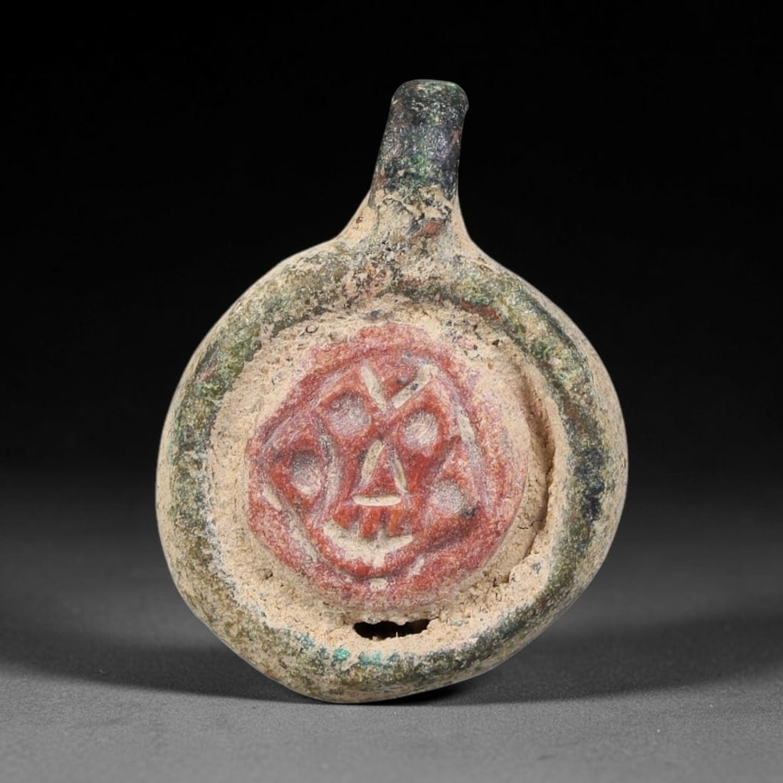 Ancient Medieval Byzantine Bronze Pendant With Stone Cameo (500-1200 CE), 67EH: This antique circular bronze pendant originates from medieval Byzantine cultural tradition, set with an inset carved stone cameo and made to serve as a wearable protective personal amulet. The bronze 