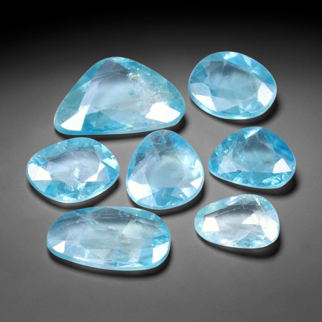 18.46ct Natural Cambodian Rose Cut Blue Zircon Loose Gemstone Parcel Lot, 18EV: This attractive parcel of rose-cut blue zircon features cool aquatic blue tones paired with flat-backed rose cut faceting, creating soft diffused sparkle and dreamy translucent visual effect. Varied f